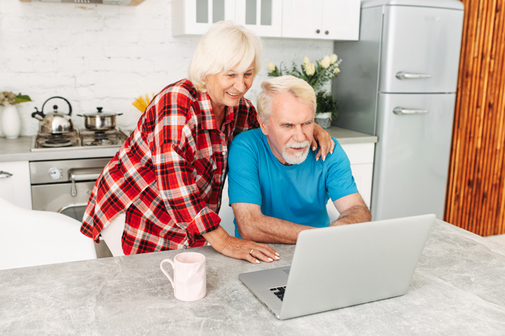 A senior couple looking up their Social Security benefits.