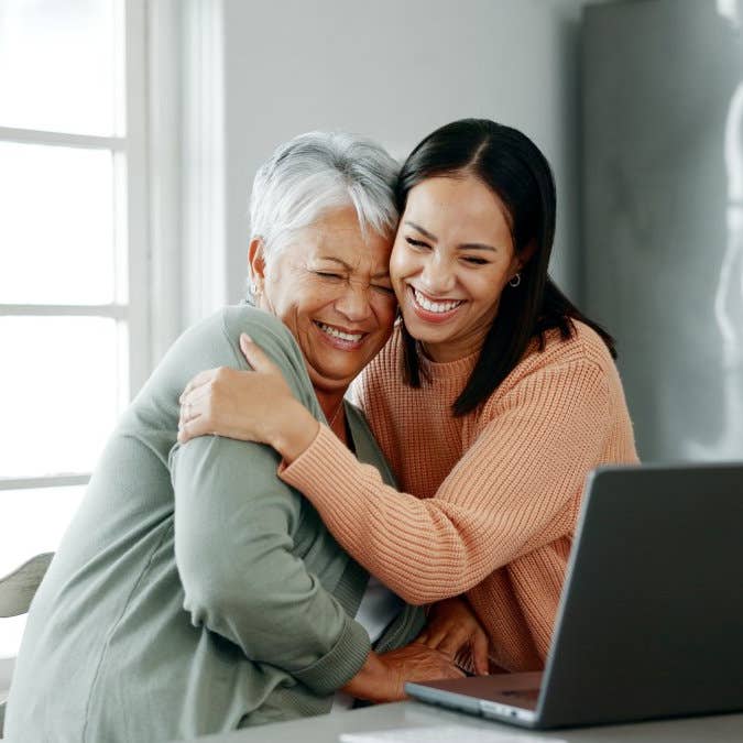Home, mother and woman with laptop for finance, track expenses and success for budget goals. Hug, senior mom and adult daughter with insurance review for retirement, investment savings and mortgage