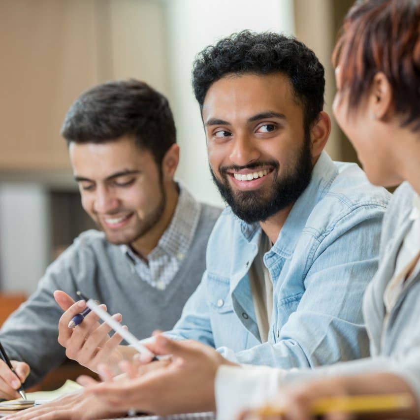 Confident businessman talks with colleagues